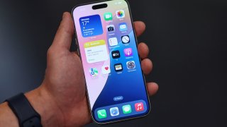 A man holds an Apple iPhone 16 Pro Max ahead of the launch of sales of the new iPhone 16 series smartphones in a store in Moscow, Russia September 20, 2024.