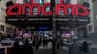 People walk past an AMC theatre in Manhattan in New York City, U.S., February 25, 2025.