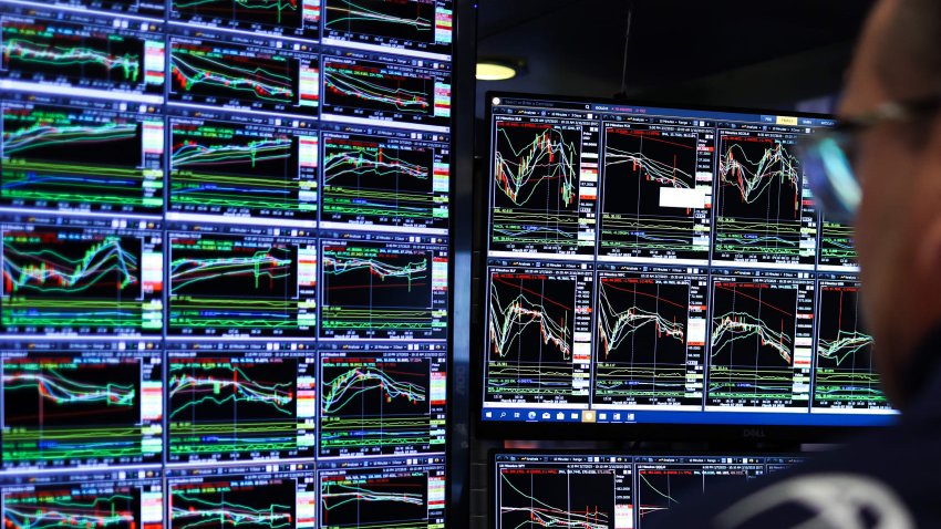 A trader works on the floor of the New York Stock Exchange (NYSE) at the opening bell in New York City on March 10, 2025. 