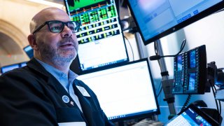 Traders work on the floor of the New York Stock Exchange on March 17, 2025. 