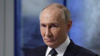 In this pool photograph distributed by the Russian state agency Sputnik, Russia’s President Vladimir Putin meets with participants in Arctic expeditions for children organized by Rosatom, in the Arctic Circle port city of Murmansk on March 27, 2025.