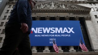 A banner for Newsmax Inc. is displayed during the company’s IPO at the New York Stock Exchange (NYSE) in New York City, U.S., March 31, 2025.