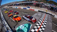 Kyle Larson, driver of the No. 5 Chevrolet, leads the field to the green flag to start the NASCAR Cup Series Cook Out 400 at Martinsville Speedway on April 7, 2024 in Martinsville, Virginia.