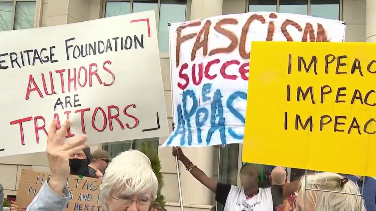 Demonstrators protest Project 2025 outside Heritage Foundation