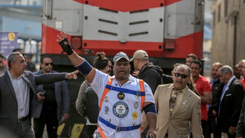 CAIRO, EGYPT – MARCH 13: Egyptian wrestler Ashraf Mahrous, known as Kabonga, pulls a passenger train by 10 metres to enter the Guinness Book of World Records at Ramses station in Cairo, Egypt on March 13, 2025.