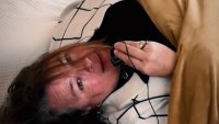 Realtor Lisa DuBois plays hide-and-seek during a video for a listing.