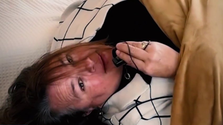 Realtor Lisa DuBois plays hide-and-seek during a video for a listing.