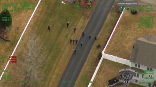 A man being arrested by a number of police in Clinton, Massachusetts, on Thursday, March 6, 2025.