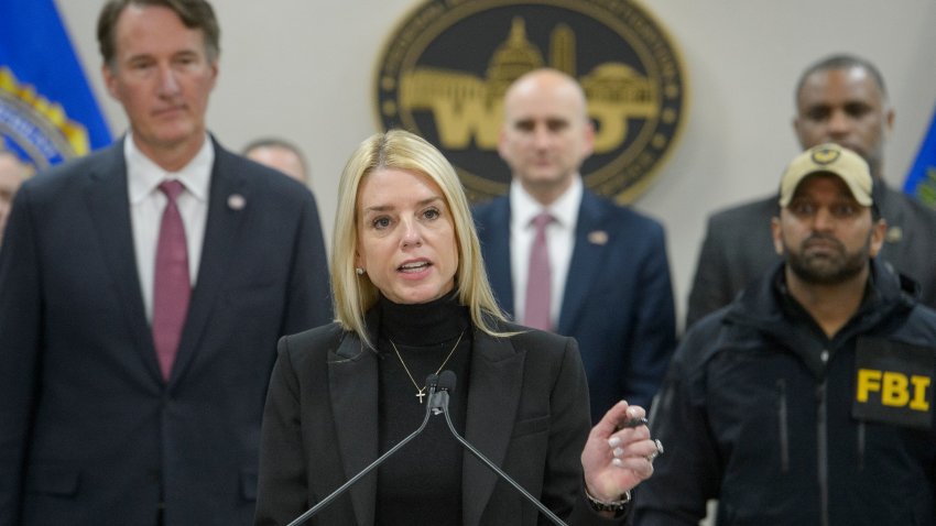 Attorney General Pam Bondi, center, joined by Virginia Gov. Glenn Youngkin, left, and FBI Director Kash Patel, right,speaks about an MS-13 gang leader who was arrested in an operation by the Virginia Homeland Security Task Force, during a news conference at the Manassas FBI Field Office, Thursday, March 27, 2025, in Manassas, Va. (AP Photo/Rod Lamkey, Jr.)