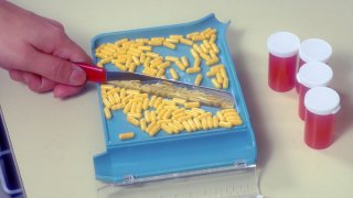 A pharmacist fills out a prescription in New York City.