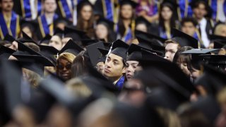 Graduates listen as actor Sean Astin delivers the keynote speech during the commencement ceremony for the College of Arts and Sciences at UCLA’s Pauley Pavilion on June 14, 2024.