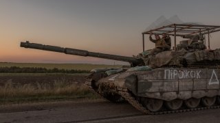 Ukrainian servicemen operate a tank on a road near the border with Russia, in the Sumy region of Ukraine, on August 14, 2024. The Ukrainian army entered Russia’s Kursk region on August 6, capturing dozens of settlements in the biggest offensive by a foreign army on Russian soil since World War II.