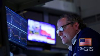 A trader works during the closing bell, on the floor at the New York Stock Exchange (NYSE) in New York City, U.S., April 10, 2025.