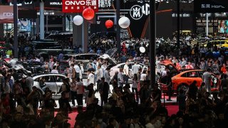 Visitors attend a major auto show in Shanghai on April 25, 2025.
