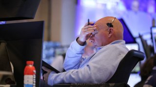A trader works on the floor at the New York Stock Exchange in New York City, U.S., April 28, 2025.