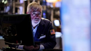 A trader works on the floor of the New York Stock Exchange on April 28, 2025.