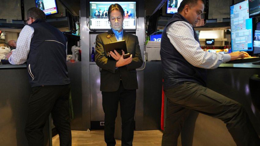 Traders work on the floor at the New York Stock Exchange in New York, Monday, April 7, 2025.