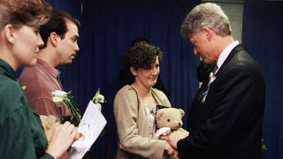 Aren Almon greets President Bill Clinton after a prayer service for the victims of the deadly truck bomb attack in Oklahoma City on April 23, 1995.