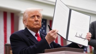 U.S. President Donald Trump displays a signed executive order imposing tariffs on imported goods during a “Make America Wealthy Again” trade announcement event in the Rose Garden at the White House on April 2, 2025 in Washington, DC. Touting the event as “Liberation Day”, Trump announced sweeping new tariffs targeting goods imported to the U.S. on countries including China, Japan and India.