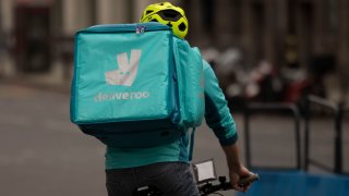 A Deliveroo rider near Victoria station in London, England, on March 31, 2021.