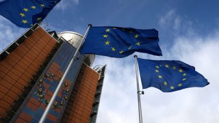 European Union flags flutter outside the EU Commission headquarters in Brussels, Belgium, on Feb. 1, 2023