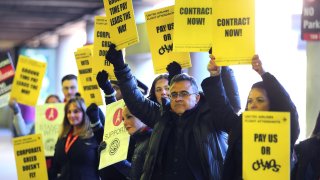 United Airline flight attendants picketed outside Terminal B at Logan Airport Thursday morning seeking a new contract.