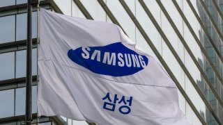 A Samsung Group flag flutters in front of the company’s Seocho building in Seoul.