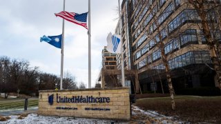 Flags fly at half staff outside the United Healthcare corporate headquarters in Minnetonka, Minnesota, Dec. 4, 2024.