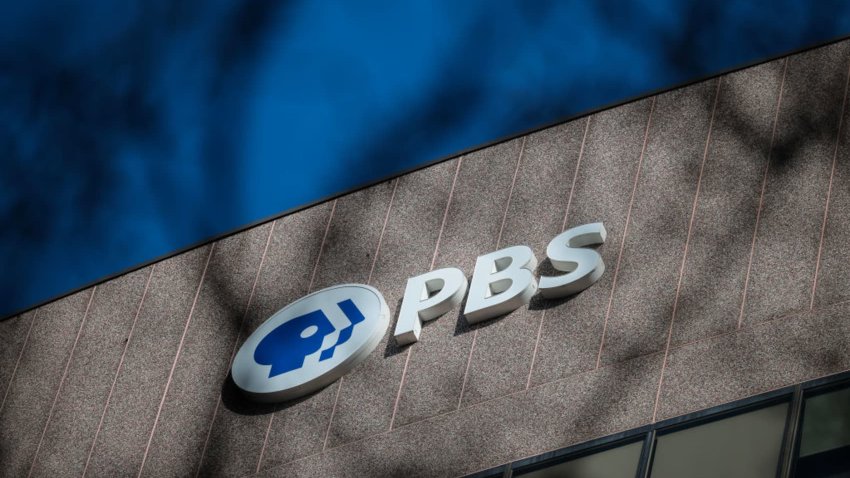 A sign for the Public Broadcasting Service (PBS) is seen on its building headquarters on Feb. 18, 2025 in Arlington, Virginia.