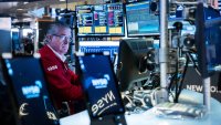 Traders work on the floor of the New York Stock Exchange on March 13, 2025. 