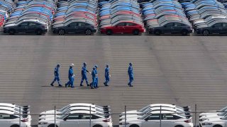 Vehicles awaiting shipment are parked at a port on March 27, 2025 in Yokohama, Japan. U.S.