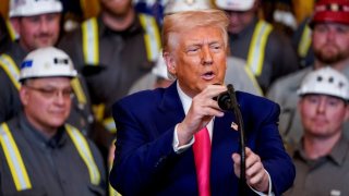 U.S. President Donald Trump speaks next to coal industry workers, on the day he signs energy-related executive orders at the White House in Washington, D.C., U.S., April 8, 2025.