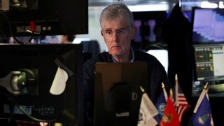 A trader works on the floor at the New York Stock Exchange (NYSE) in New York City, U.S., April 10, 2025.