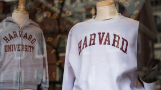 Harvard sweatshirts are displayed for sale in a school store window on the Harvard University campus in Cambridge, Massachussetts, on April 15, 2025.