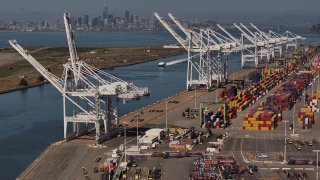 In an aerial view, shipping cranes sit idle at the Port of Oakland on April 28, 2025 in Oakland, California.