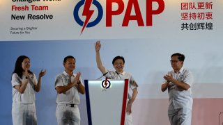 Singapore Prime Minister Lawrence Wong of the People’s Action Party (PAP) waves to supporters as he celebrates at the party’s gathering center during the general election results, in Singapore on May 3, 2025.