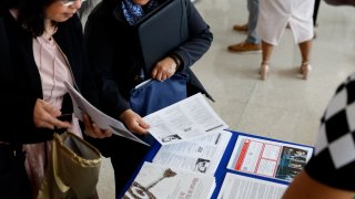 Job seekers at a job fair hosted by the Metropolitan Washington Airports Authority to support federal workers looking for new career opportunities, at Ronald Reagan Washington National Airport in Arlington, Virginia, on April 25, 2025.
