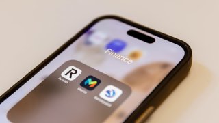 The app icons for Revolut and Monzo displayed on a smartphone.