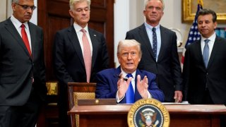 U.S. President Donald Trump gestures on the day he signs an executive order on prescription drug pricing, next to U.S. Health and Human Services (HHS) Secretary Robert F. Kennedy, Jr., during a press conference in the Roosevelt Room at the White House in Washington, D.C., U.S., May 12, 2025. REUTERS/Nathan Howard