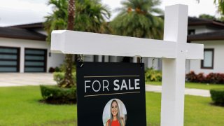 A For Sale sign sits in front of a home on May 12, 2025 in Miami, Florida.