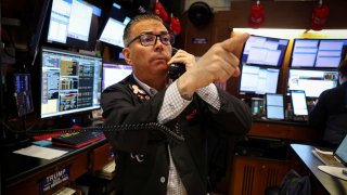 A trader works on the floor at the New York Stock Exchange on May 12, 2025.