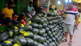Indian shopkeepers sell summer fruit watermelons at their roadside stalls in a market area in Siliguri, India on May 2, 2025.
Watermelon is a very popular fruit during the summer season.