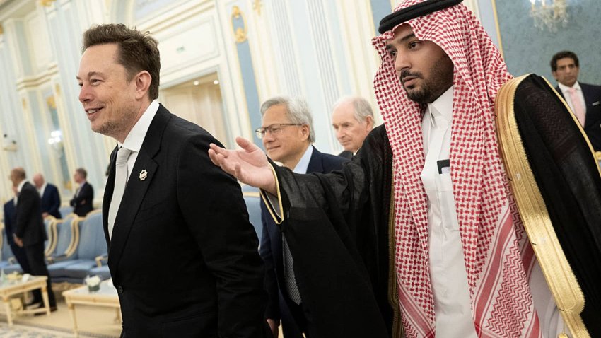 Senior Advisor to the US President Elon Musk (L) and Nvidia CEO Jensen Huang (C) are directed to greet the Saudi Crown Prince at the Royal Court in Riyadh on May 13, 2025.