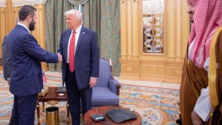 U.S. President Donald Trump meets with Syrian President Ahmed al-Sharaa in Riyadh, Saudi Arabia, in this handout released on May 14, 2025.