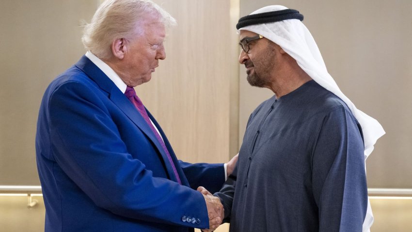 UAE President Sheikh Mohamed bin Zayed Al Nahyan (R) welcomes his US counterpart Donald Trump upon arrival at the presidential terminal in Abu Dhabi on May 15, 2025.
