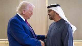 UAE President Sheikh Mohamed bin Zayed Al Nahyan (R) welcomes U.S. President Donald Trump upon arrival at the presidential terminal in Abu Dhabi on May 15, 2025.