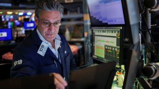 A trader works during the closing bell, on the floor at the New York Stock Exchange (NYSE) in New York City, U.S., May 19, 2025.