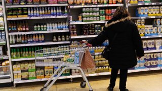 A customer looks at goods on a shelf in a supermarket on January 15, 2025 in London, England.
