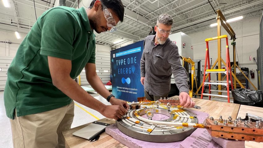 Type One Energy employees work on their fusion stellarator technology.