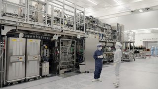 ASML’s Assia Haddou shows CNBC’s Katie Tarasov a High NA chipmaking machine in Veldhoven, Netherlands, on April 24, 2025.